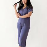 Woman modeling Women's Ribbed Jumpsuit in Currant