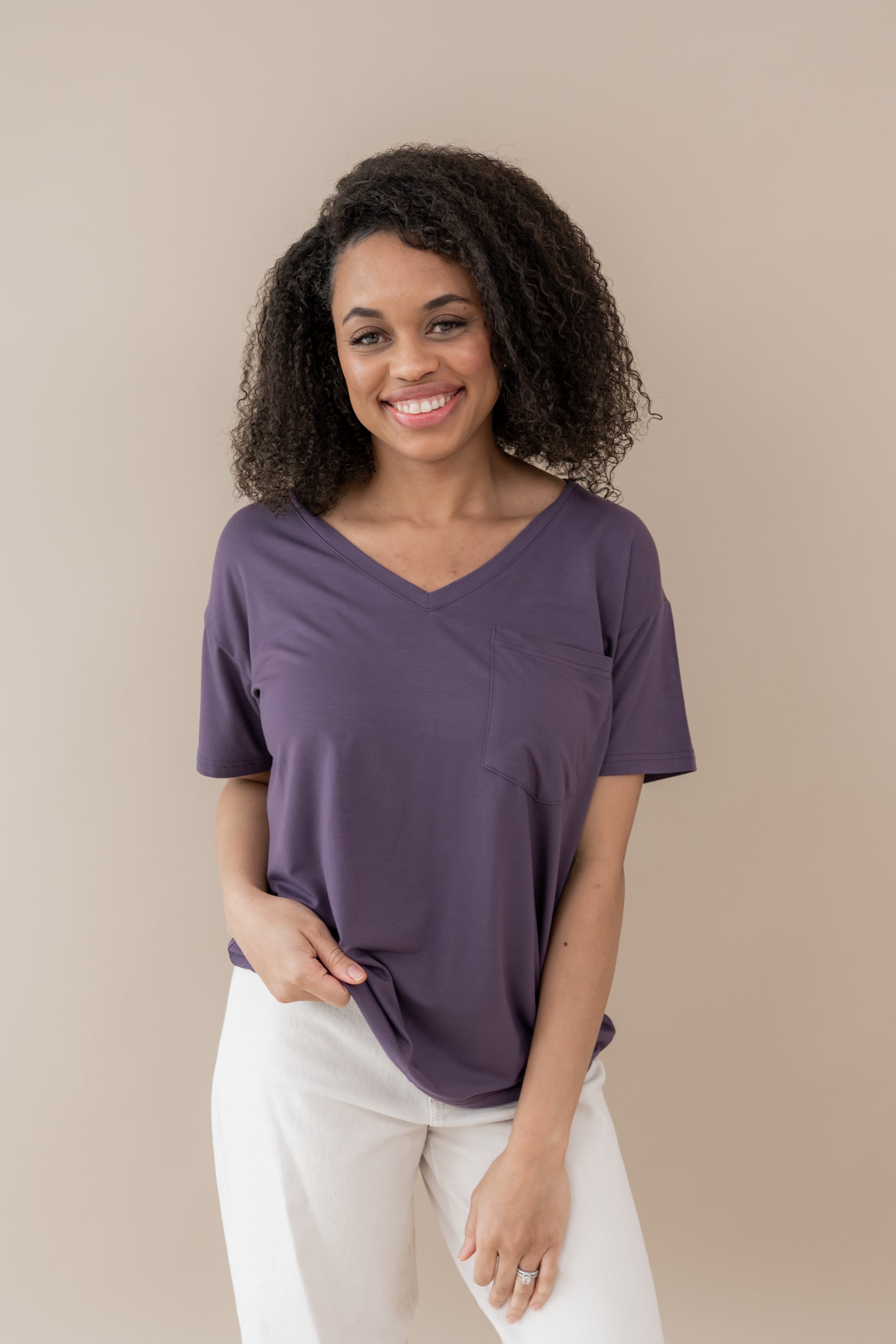 Female model wearing the Women’s Relaxed Fit V-Neck in Currant