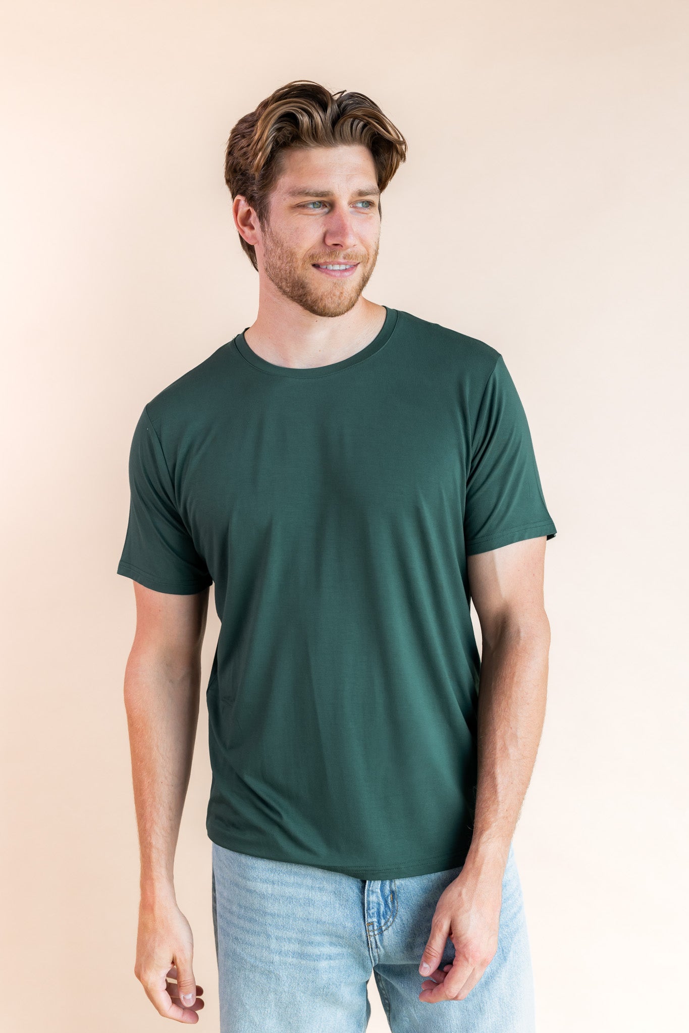 Man looking to the side smiling in a crew neck tee in cypress
::: Model is 6'3" wearing size L ///