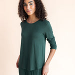 Woman soft smiling standing angled in jogger pajama set in cypress