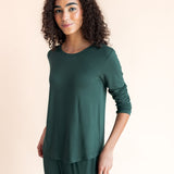 Woman soft smiling standing angled in jogger pajama set in cypress