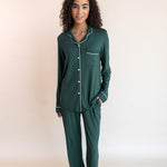 Woman standing with one hand in her pocket wearing long sleeve pajama set in cypress

::: Model is 5'10" wearing size XS Tall ///