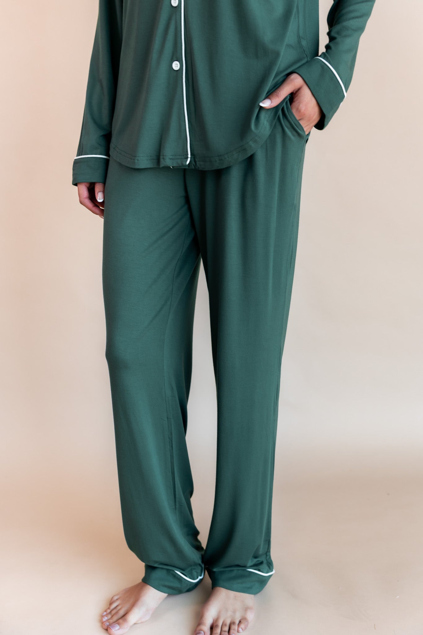 Bottom half of a woman with her hand in her pant pocket wearing long sleeve pajama set in cypress

---1605 3