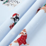 Close up of blue fabric with Holiday pups print on it