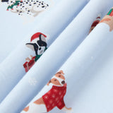 Close up of blue fabric with Holiday pups print on it