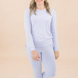 Woman modeling matching jogger set in a lilac color 