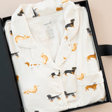 Long-Sleeved Women's Pajama Set in Dachshund print packed in a box on a beige background