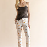Model wearing Women's Lounge Pants in Dachshund paired with a camisole in espresso background ::: Model is 5'9" wearing size XS ///