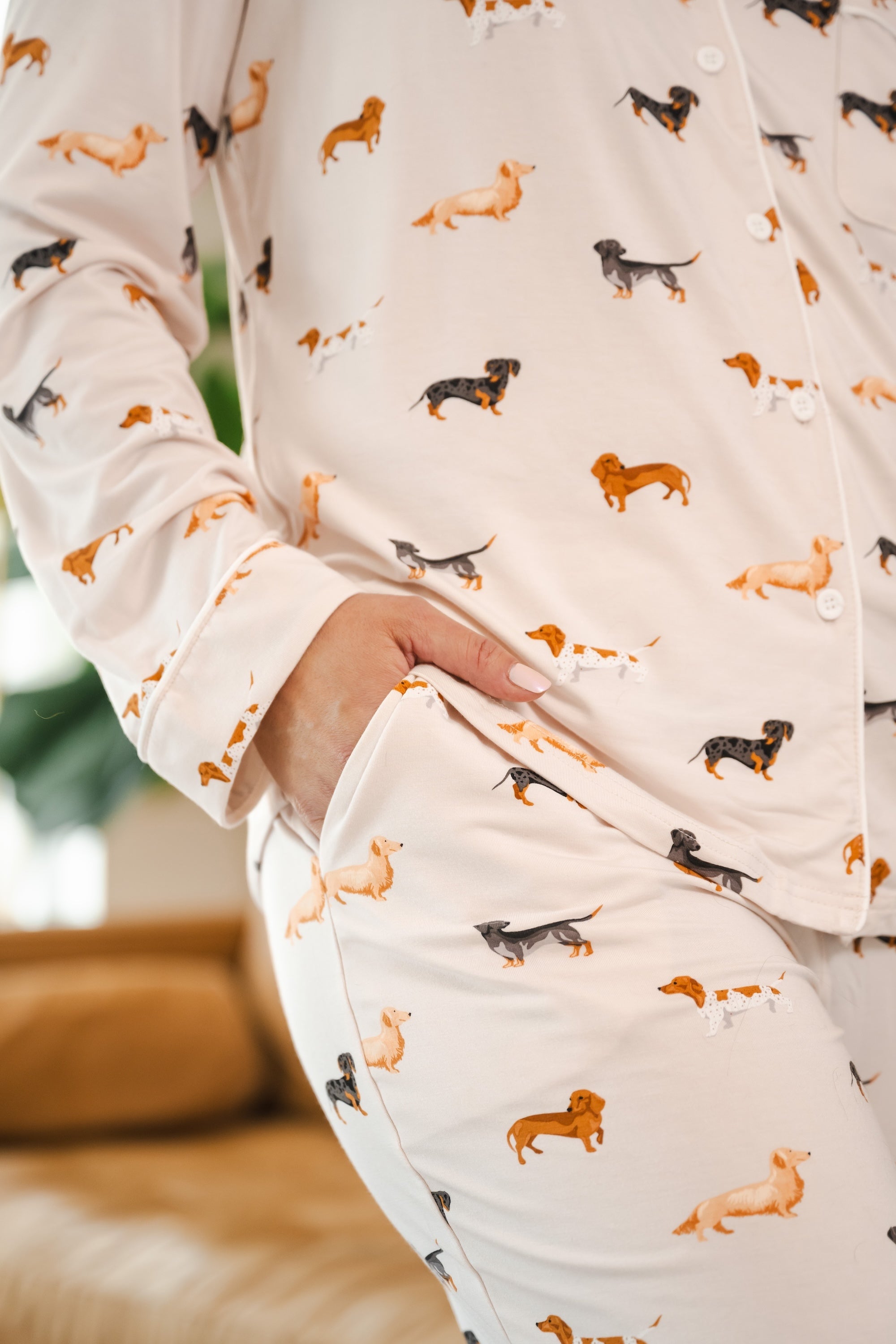 Model showing pockets on Beige Long-Sleeved Women's Pajama Set in Dachshund print

---1605 1