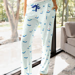 Close up of the Women's Lounge Pants in Dew Mahjong on a model leaning against a large window

::: Model is 5'10" wearing size S ///