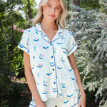 Model standing in front of shrubs while wearing the Women's Short Sleeve Pajama Set in Dew Mahjong

::: Model is 5'11" wearing size S ///