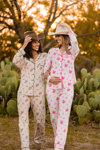  Models in cowboy hats wearing the Long Sleeve Pajama Sets in Classic Cowboy and Disco Cowgirl