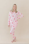 Female modeling the Women's Jogger Pajama Set in Disco Cowgirl with one hand on her hip in front of a light taupe backdrop