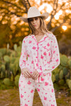 Female modeling the Long-Sleeved Women's Pajama Set in Disco Cowgirl outside in front of trees and cacti  ::: Model is 5'11" wearing size S ///