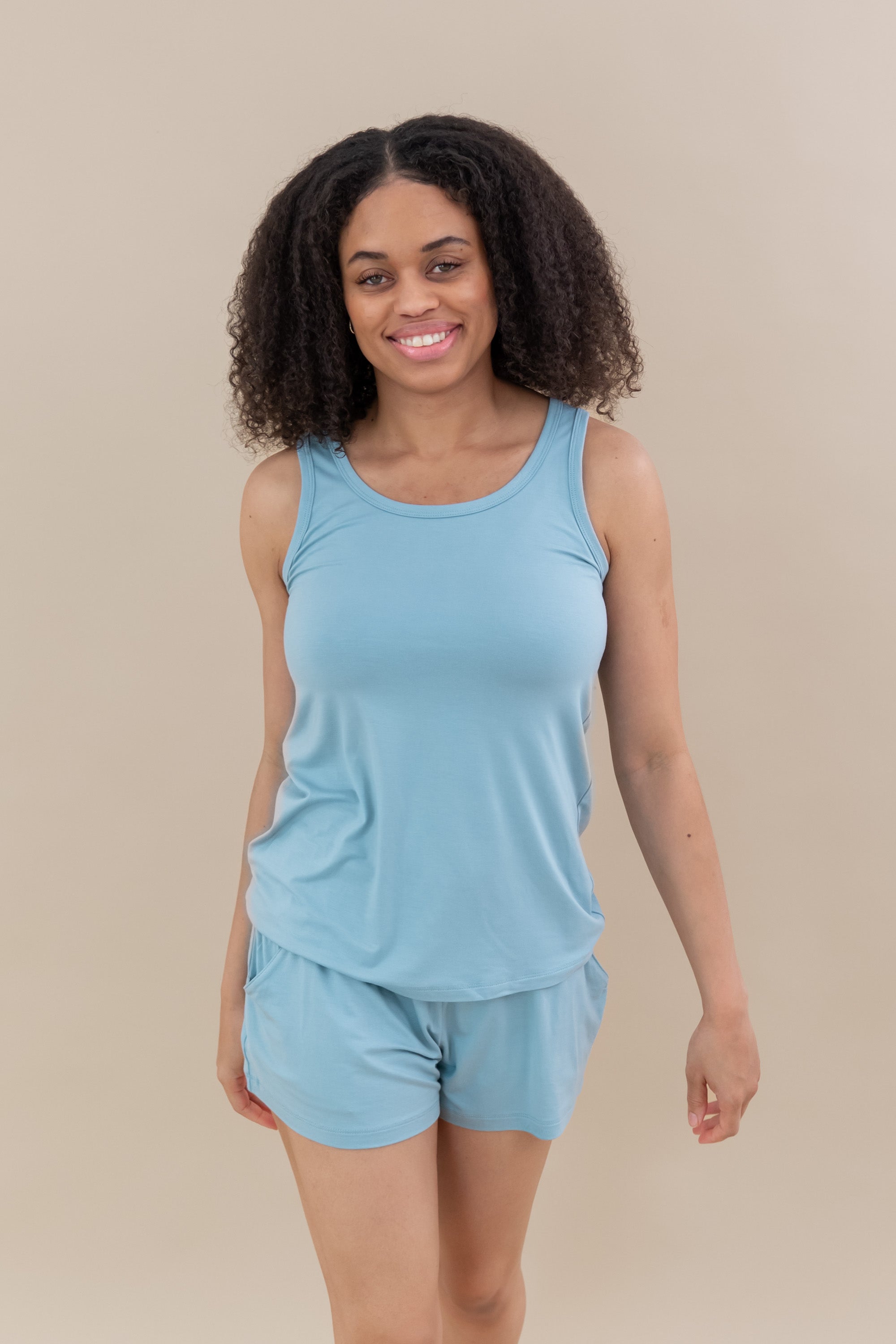 Female model wearing the Women’s Tank Set in Dusty Blue