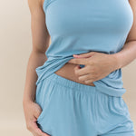 Close up of the elastic waistband and pocket on the shorts in the Women’s Tank Set in Dusty Blue