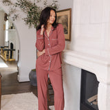 Modal posing in Long-Sleeved Women's Pajama Set in Ember standing in a living room
---PJ 4