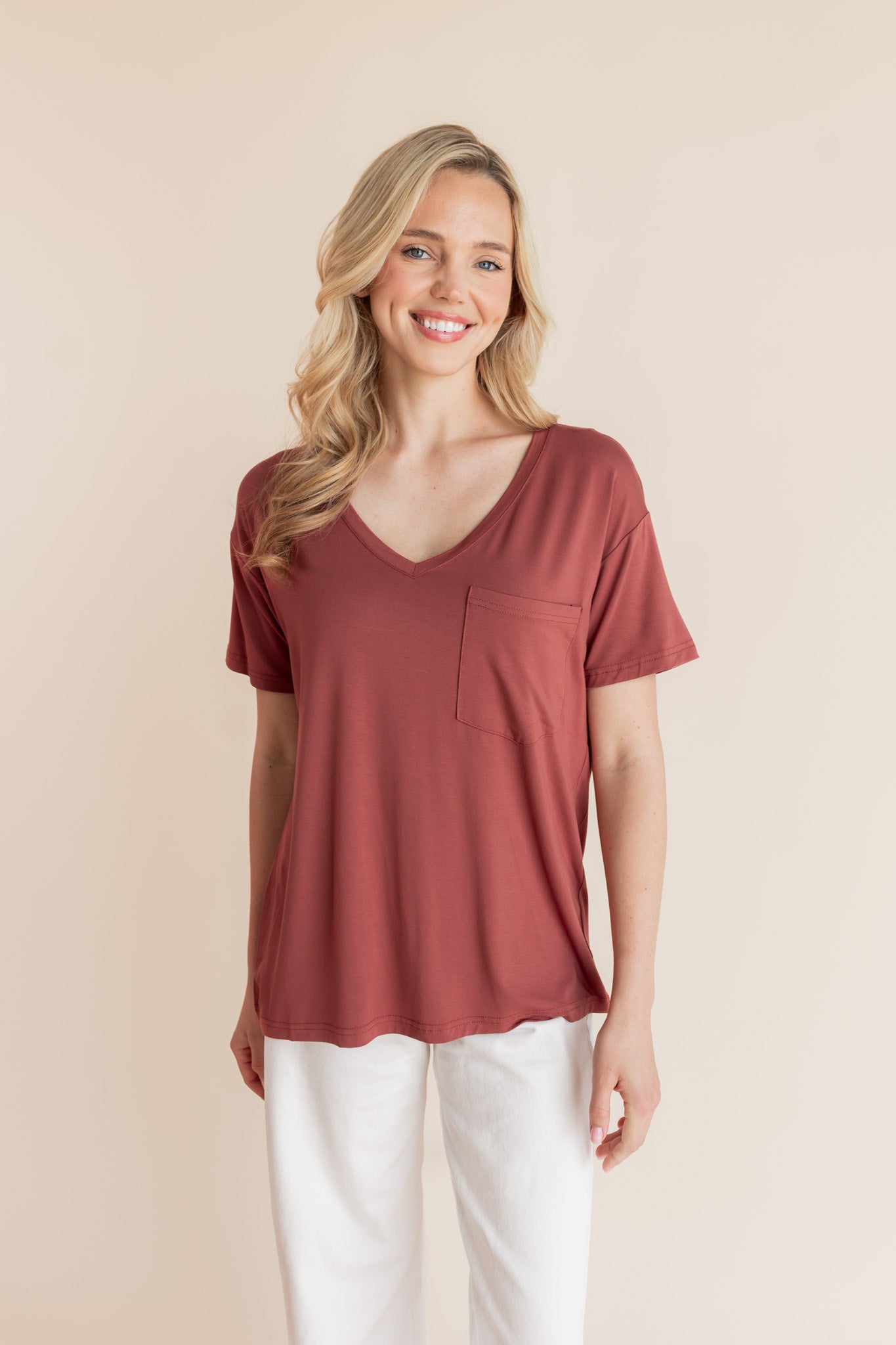 Woman modeling a muted terracotta v-neck oversized tee
::: Model is 5'9" wearing size XS ///
