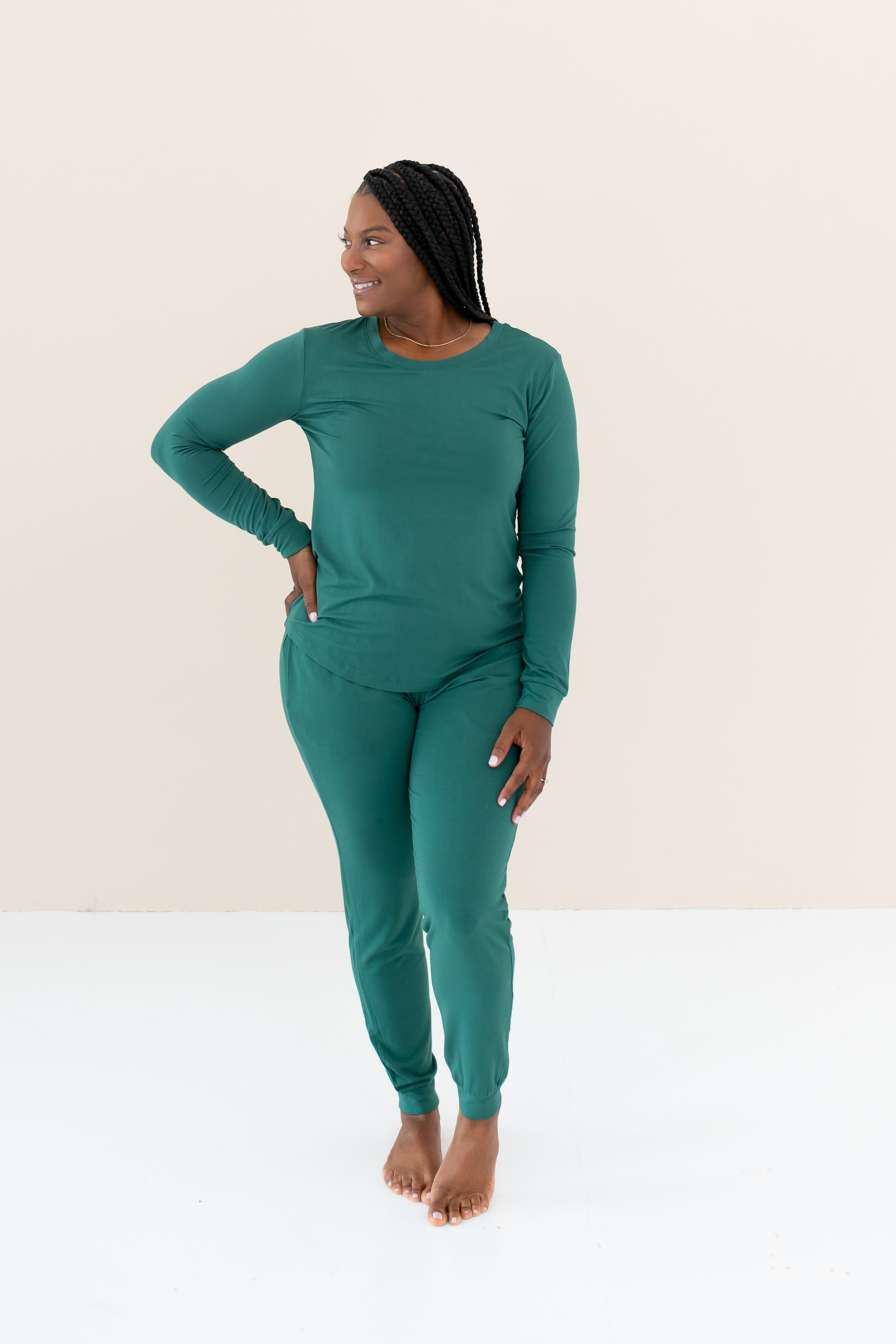 Woman modeling Women's Jogger Pajama Set in Emerald with hand on hip looking off to the side