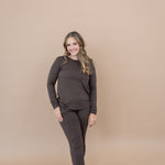 Smiling model wearing the Kyte Women's Jogger Set in Espresso 