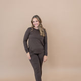 Smiling model wearing the Kyte Women's Jogger Set in Espresso 