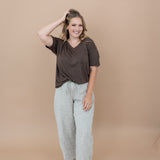 Smiling model with  her hand in her hair while modeling the Women's V Neck in Espresso 
