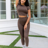 Female posing wearing the Bamboo Flex Baby Tee in Espresso with matching leggings

::: Model is 5'0" wearing size XS ///