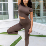 Female model posing wearing the Bamboo Flex Baby Tee in Espresso and matching leggings