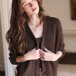 Woman with her head tilted holding the sides of her cardigan in espresso
::: Model is 5'8" wearing size XS ///