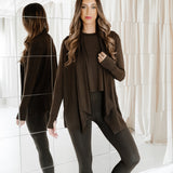 Model standing in front of a mirror wearing the Bamboo Flex Women’s Leggings in Espresso with matching short sleeve tee and matching french terry wrap