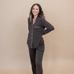 Smiling model with hand on hip while wearing the Long Sleeve Women's Pajama Set in Espresso