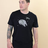 Male modeling the Men's Crew Neck Tee in Millennium Falcon™ with black jeans