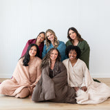 Models wrapped in Quilt Blankets in Fall Solids: Burgundy, Atlantic, Fir, Latte, Coffee and Bisque