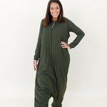Smiling model wearing the Adult Sleep Bag Walker in Fir with hand on hip