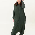 Model with hand in hair and wearing the Kyte Adult Sleep Bag Walker in Fir p