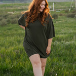 Model in a grassy field wearing the  Women's Biker Short Set in Fir
