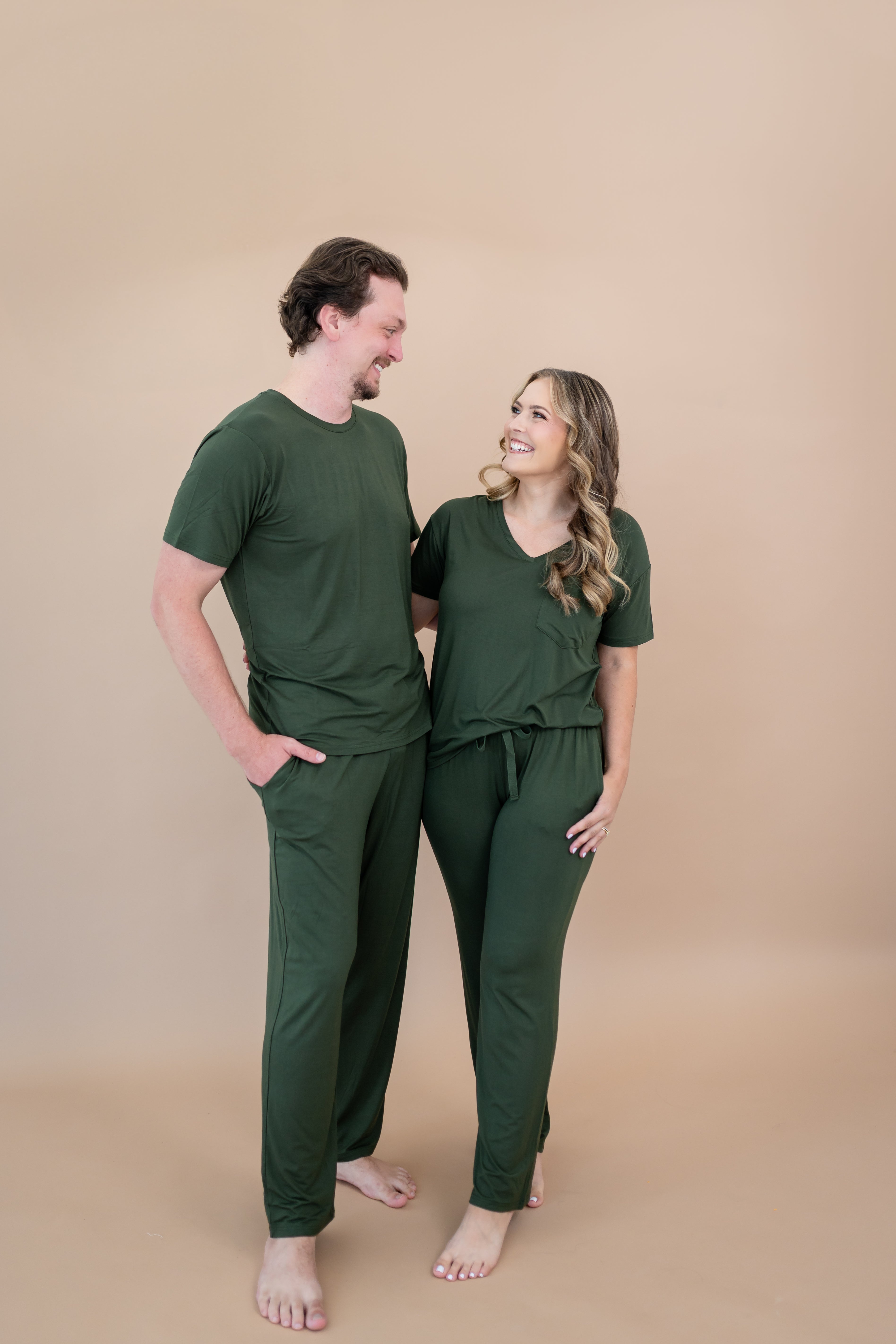 Couple wearing matching sets in Fir