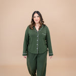 Model walking towards camera while wearing the Women's Long Sleeve Pajama Set in Fir