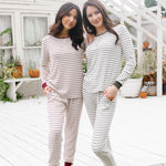  Models standing on steps while wearing the Women's RIbbed Henley Set in Burgundy Stripe and Fir Stripe