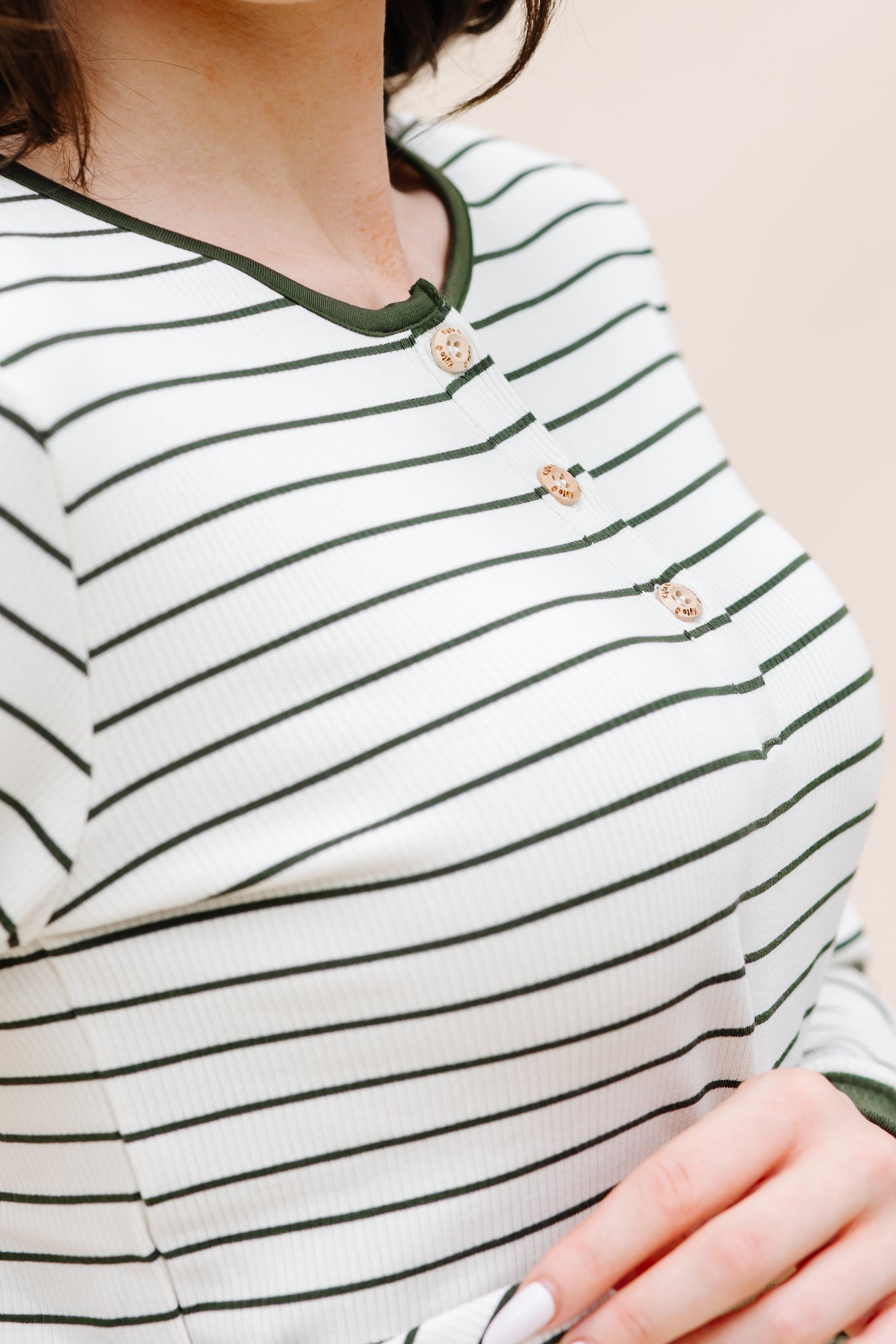 Close up of the buttons on the top of the Women’s Ribbed Henley Set in Fir Stripe