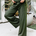 Close up of the  Women's Wide Leg Pant in Fir with one leg up