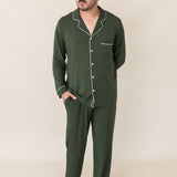 Model with hand in pocket while wearing the Kyte Men's Long Sleeve Pajama Set in Fir