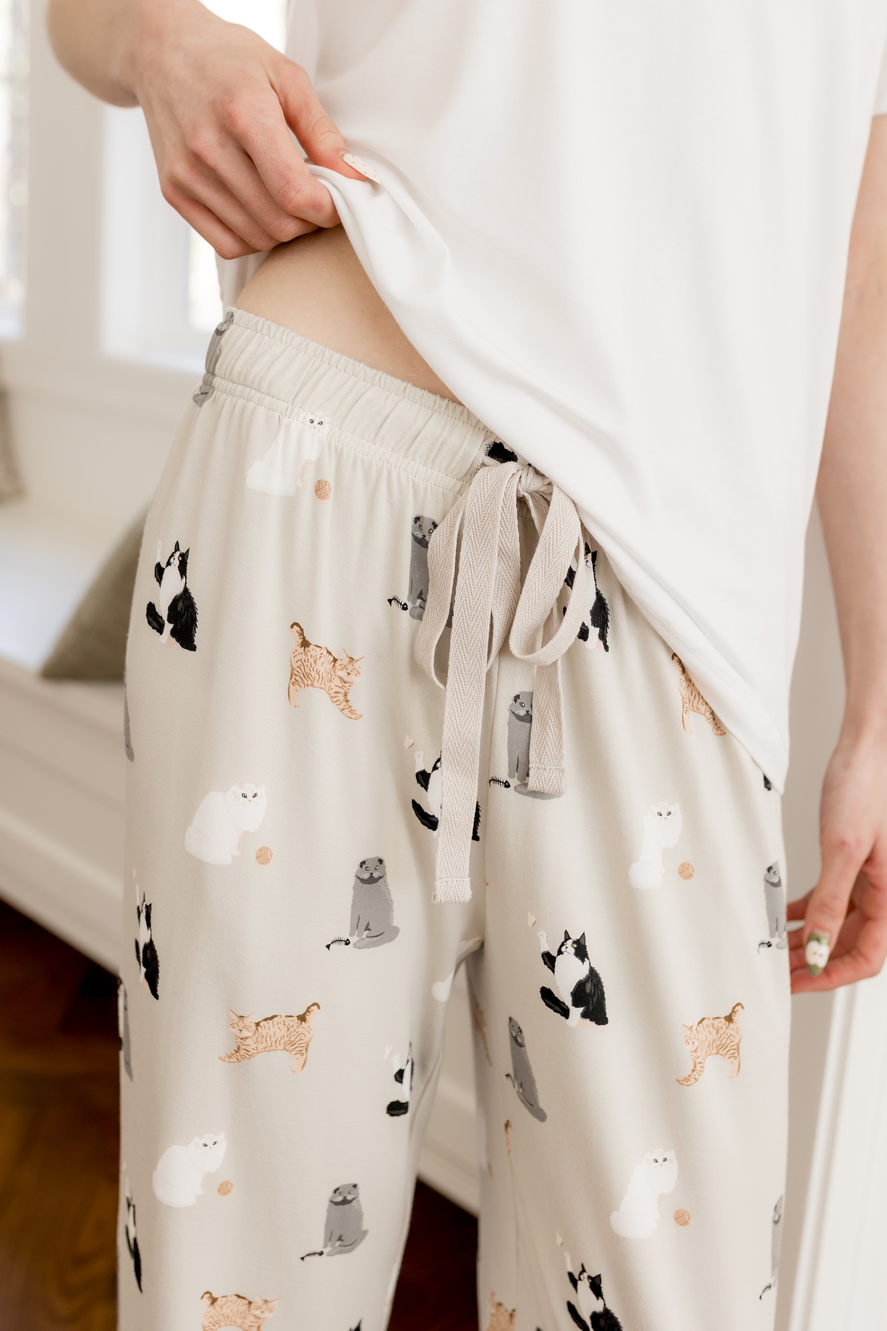 Drawstring on Women's lounge pant in Fluffy Cat print under a white tee