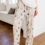 Person wearing Women's lounge pant with Fluffy Cat print under a white tee 
