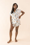 Female modeling the Women's Short Sleeve Pajama Set in Fluffy Dog ::: Model is 5'3" wearing size S ///