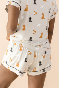 The back of the Women's Short Sleeve Pajama Set in Fluffy Dog shown on a female model