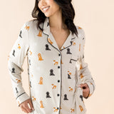 The shirt of the Long-Sleeved Women's Pajama Set in Fluffy Dog shown on a smiling female model