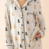 Close up of the button closure, trim and chest pocket on the shirt shown on the Long-Sleeved Women's Pajama Set in Fluffy Dog
