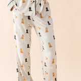 The pants of the Long-Sleeved Women's Pajama Set in Fluffy Dog shown on a model
