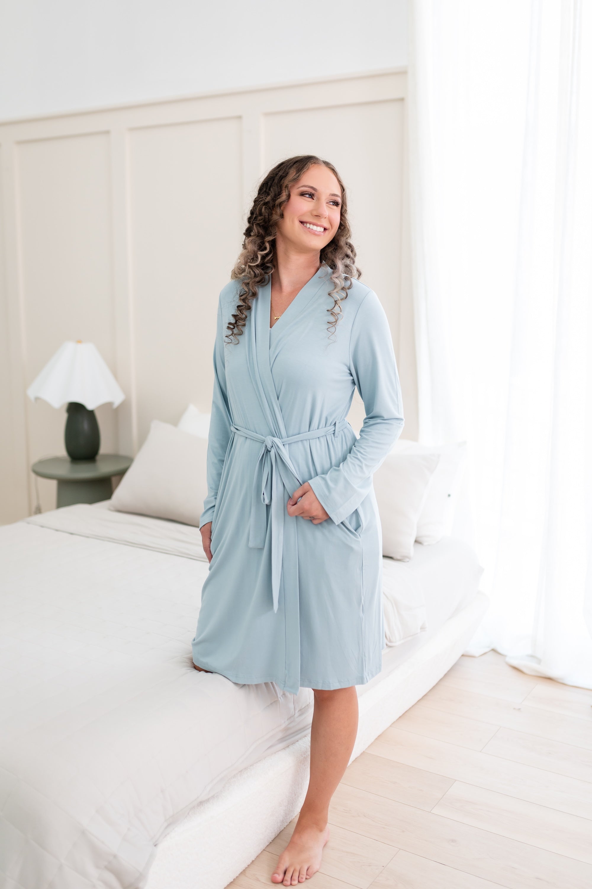 Woman wearing Women’s Lounge Robe in Fog in a bedroom setting